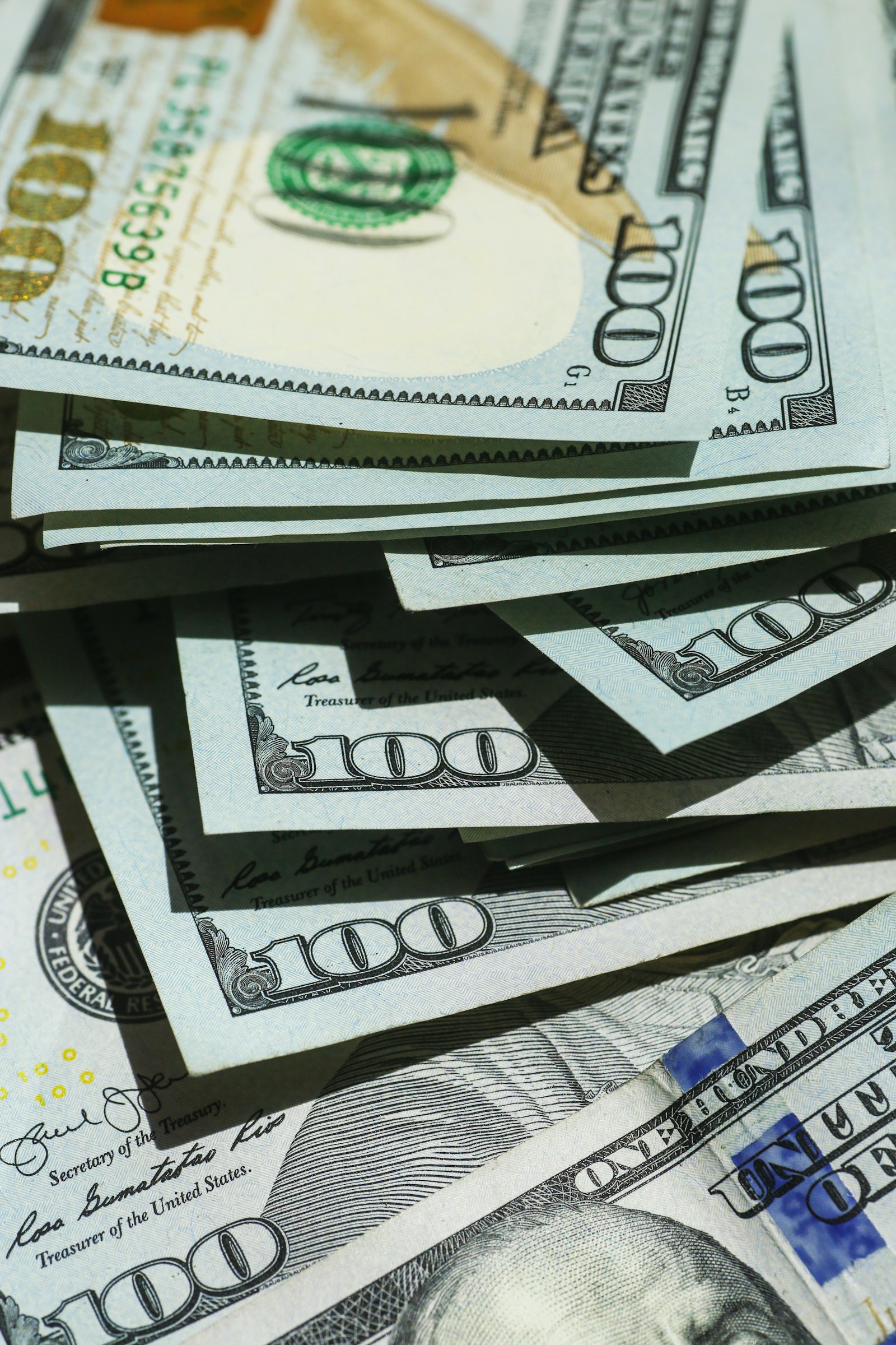 Overlapping United States one hundred dollar bills